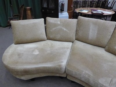 Lot 1303 - A Roche Bobois French curved sofa in gold crushed velvet, 540cm wide by 225cm deep by 167cm
