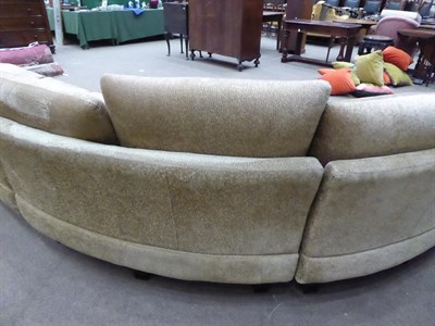 Lot 1303 - A Roche Bobois French curved sofa in gold crushed velvet, 540cm wide by 225cm deep by 167cm