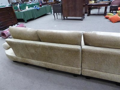 Lot 1303 - A Roche Bobois French curved sofa in gold crushed velvet, 540cm wide by 225cm deep by 167cm