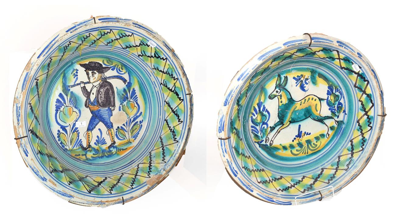 Lot 1 - ~ Two large 19th century Spanish Talavera type tin glazed earthenware bowls, one decorated with...