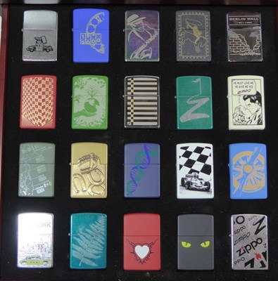 Lot 6 - ~ Two collectors display cases each containing forty Zippo lighters over two layers, US Navy,...