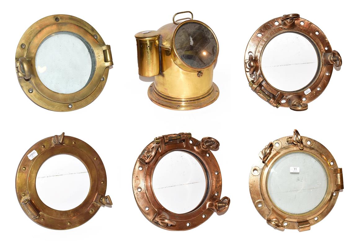 Lot 11 - ~ Five brass ships portholes, two with glass, together with a brass cased marine compass on...