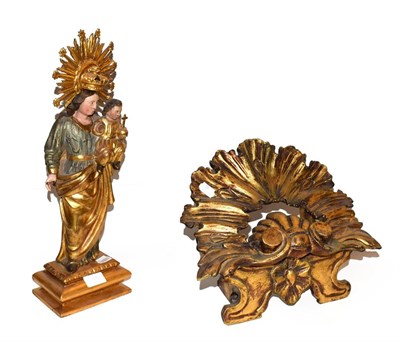 Lot 15 - ~ A Continental gilt and polychrome wood devotional statue of Mary and the Christ Child, 46cm high