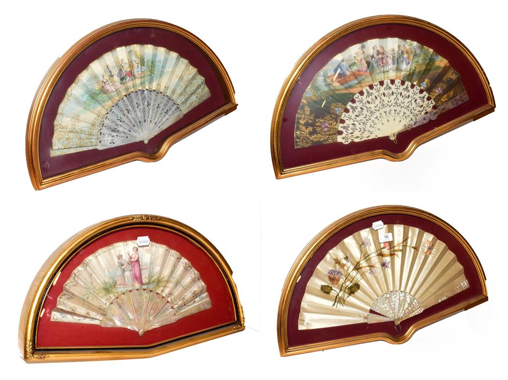Lot 16 - ~ Four fans each in a gilt framed wall hanging display case, including a silk example...