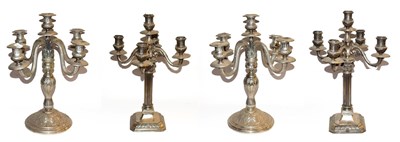 Lot 17 - ~ Two pairs of Continental silver plated five branch candelabra, one pair of Corinthian column form