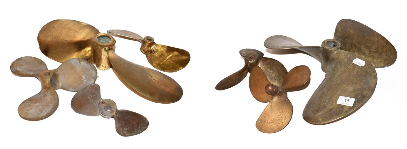 Lot 18 - ~ A quantity of brass two and three blade boat propellers, largest 40cm wide (7)