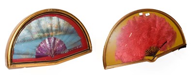 Lot 21 - ~ Two fans in gilt framed wall hanging display cases, one faux tortoiseshell and ostrich...