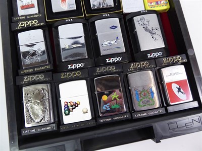Lot 22 - ~ A collection of Zippo lighters, various themes (3 trays)
