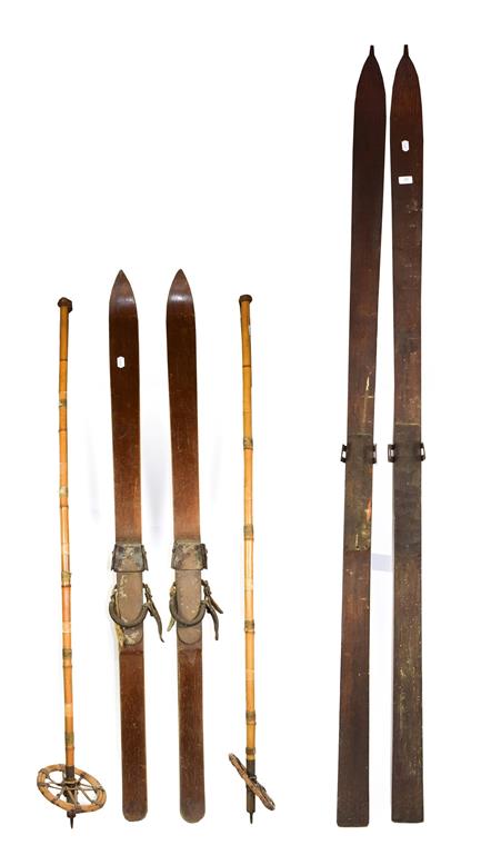 Lot 25 - ~ Two pairs of vintage wooden skis and a pair of bamboo poles (6)