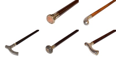 Lot 29 - ~ A German malacca walking cane with silver topper stamped 800 and four other walking canes...
