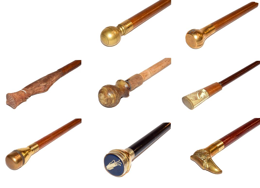 Lot 34 - ~ A quantity of walking canes with brass toppers etc (8)