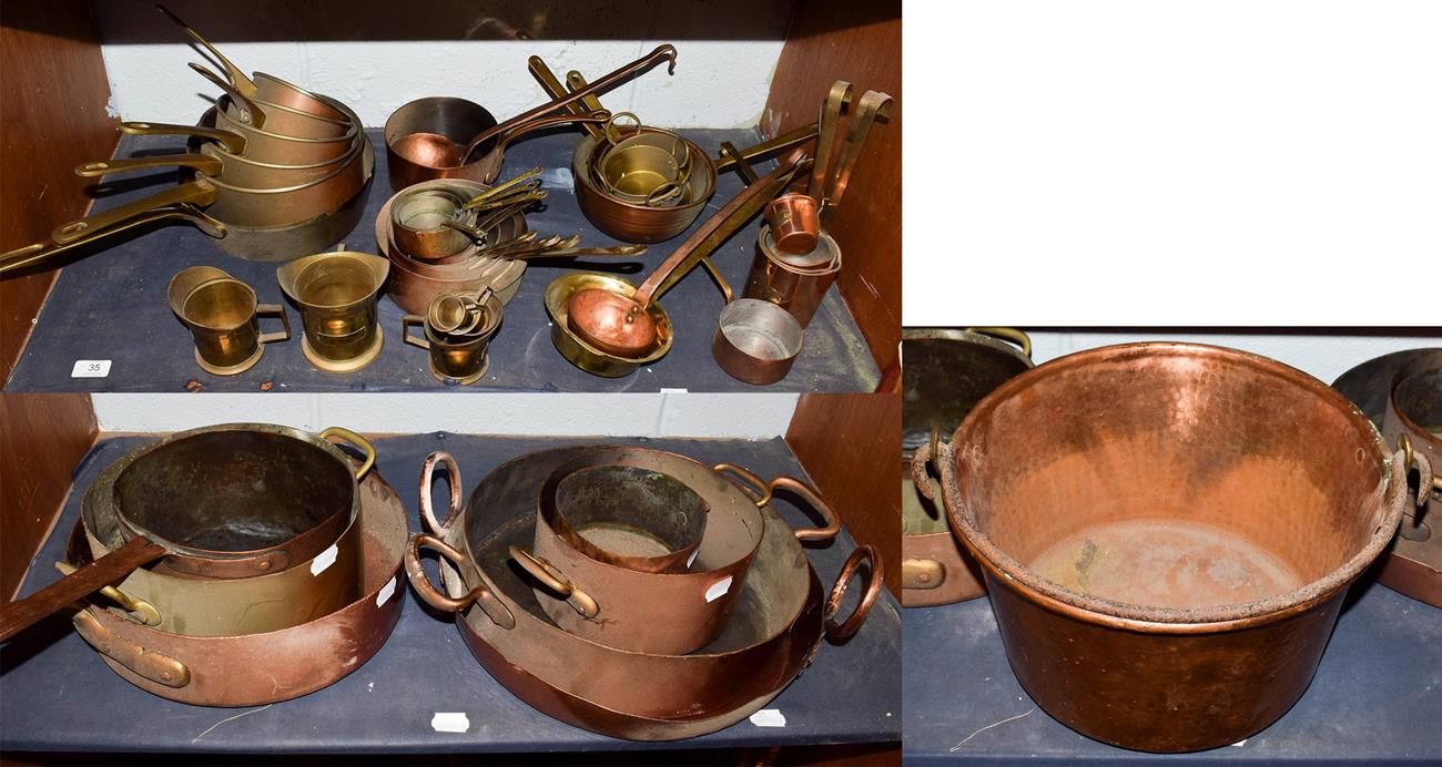 Lot 35 - ~ A collection of mainly antique brass and copper cooking wares, including graduated pans and...