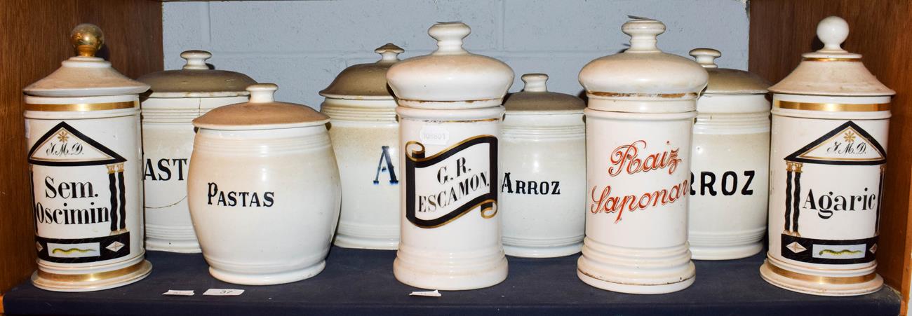 Lot 37 - ~ A quantity of Spanish pottery food storage jars and covers with enamel and gilt lettering (1...