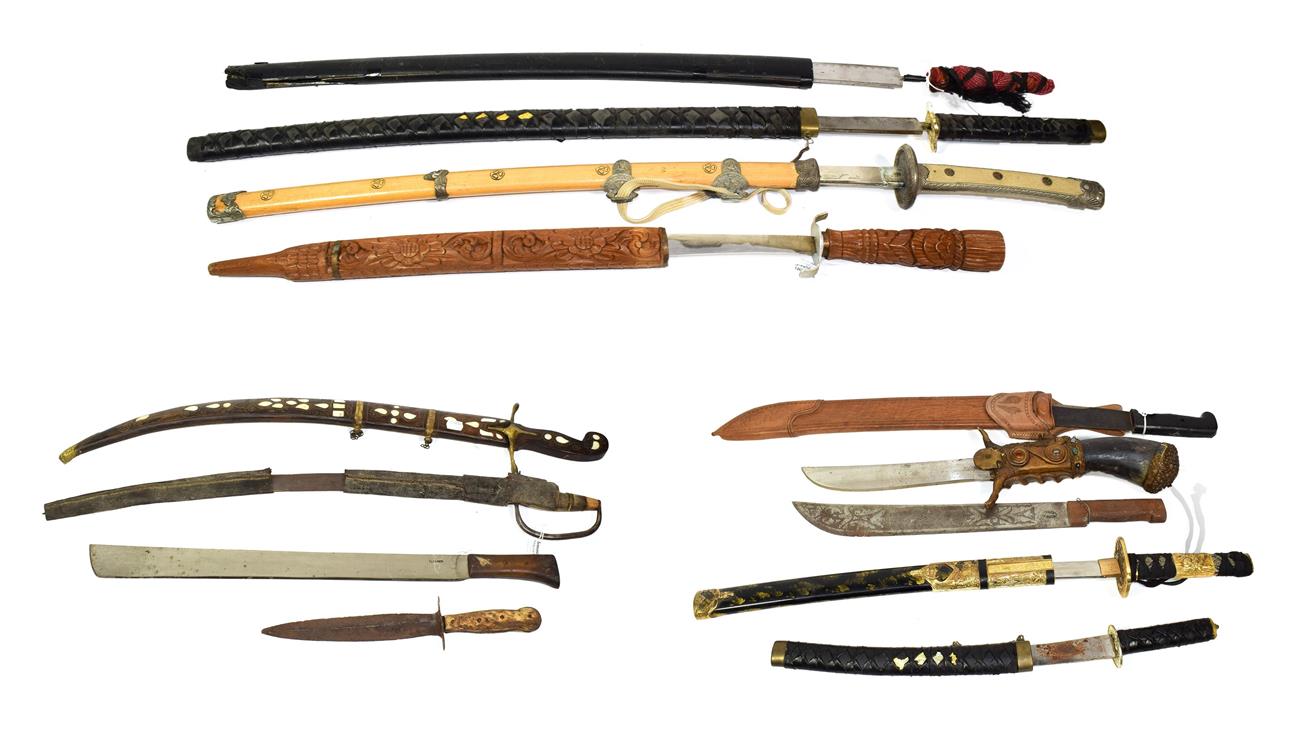 Lot 41 - ~ Three machetes, an Indian sword with wood scabbard and a quantity of copy swords