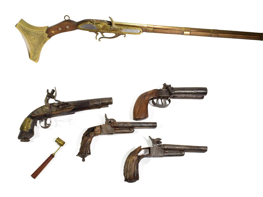 Lot 43 - ~ A Modern non-working copy of a jezail; a double barrel percussion pistol; two relic condition...