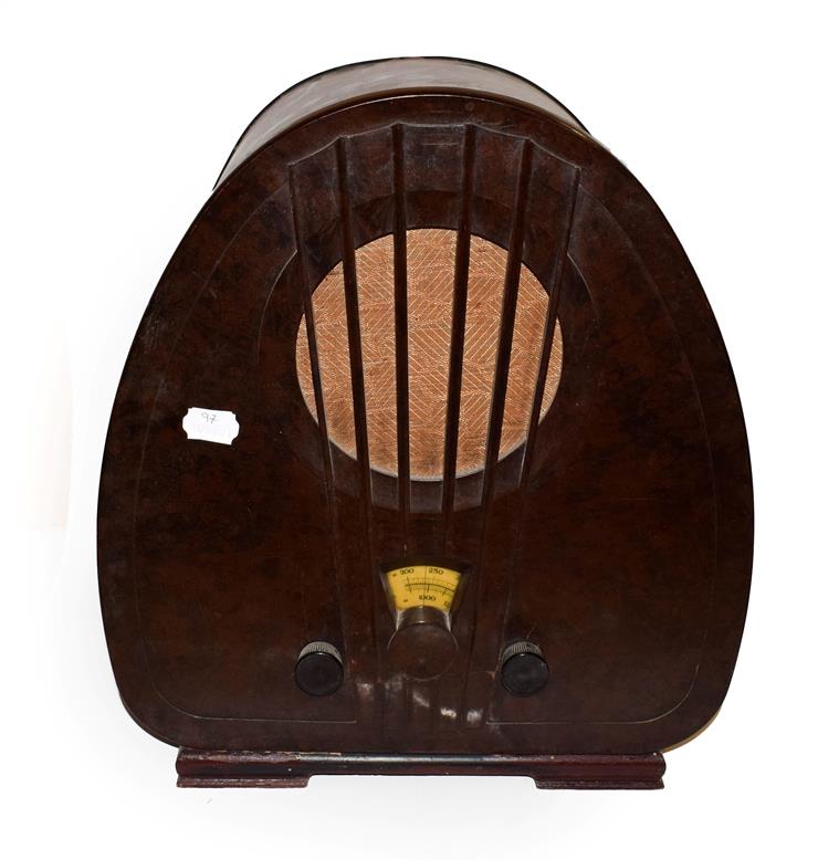 Lot 48 - ~ An Art Deco Philips valve radio in Bakelite case, 44.5cm