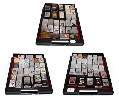 Lot 54 - ~ A collection of Zippo lighters including advertising examples (3 trays)