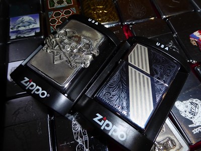 Lot 54 - ~ A collection of Zippo lighters including advertising examples (3 trays)