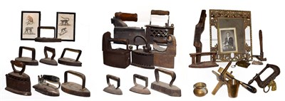 Lot 55 - ~ A collection of metalwares, mainly flat irons and box irons, antique leather working tools...