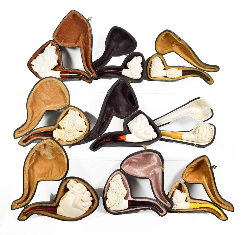 Lot 61 - ~ A collection of Meerschaum pipes including an erotic example and others formed as Turks (1 tray)