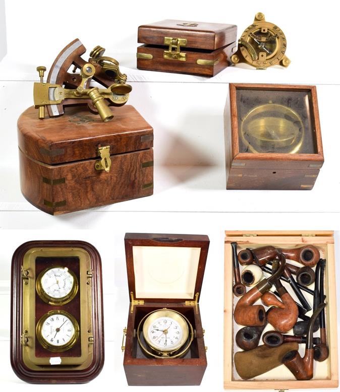 Lot 62 - ~ Reproduction marine instruments in cases including compasses, sextant and quartz ships clock,...