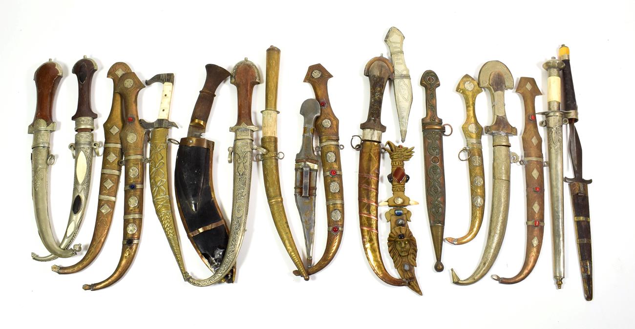 Lot 65 - ~ Assorted daggers and kinjhals in scabbards including metal mounted Indian examples, Gurkha...