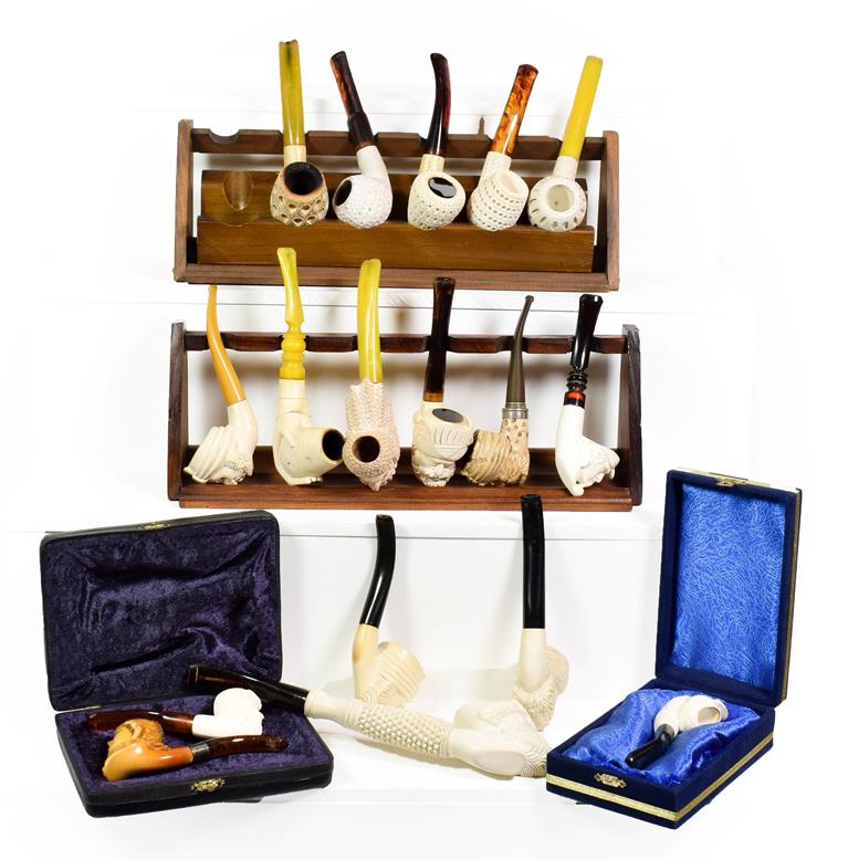 Lot 67 - ~ Two pipe racks and a quantity of Meerschaum pipes formed as Turks etc (1 tray)
