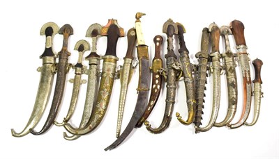 Lot 68 - ~ A quantity of Indian kinjhals and daggers in metal mounted scabbards, including inlaid and...