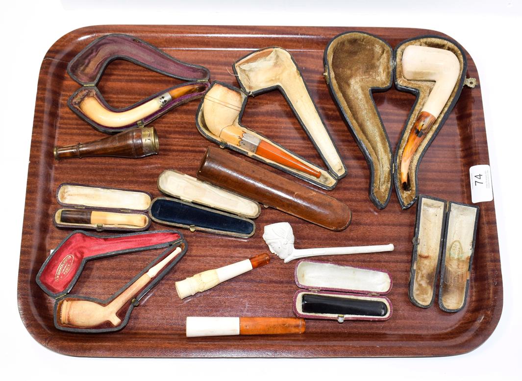 Lot 74 - ~ A collection of cased meerschaum pipes, cheroot holders and a figural clay pipe (1 tray)