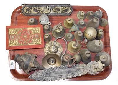 Lot 79 - ~ A collection of metalwares etc including a quantity of bronze bells, Eastern Buddha head, two...