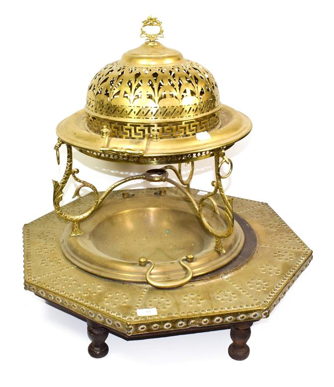 Lot 91 - ~ A Continental brass brazier with pierced domed cover and another of octagonal form with...