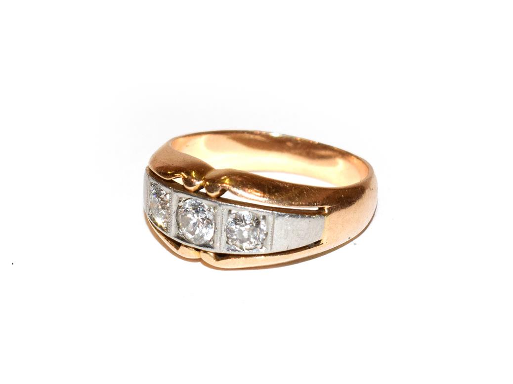 Lot 101 - ~ A diamond three stone ring, the graduated old cut diamonds in white claw settings, to a...