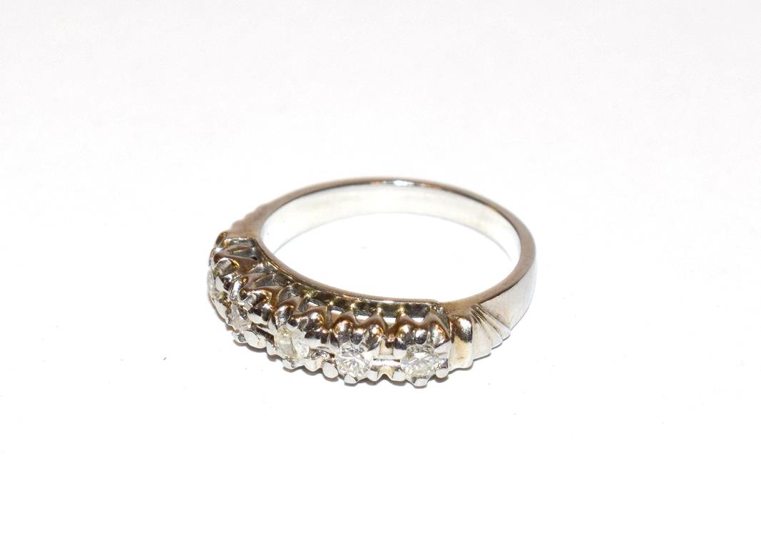 Lot 108 - ~ A diamond five stone ring, the round brilliant cut diamonds in white claw settings, to a...
