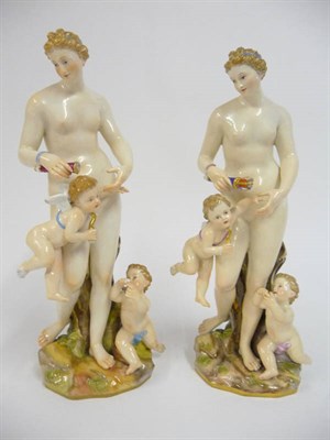 Lot 118 - A Pair of Meissen Porcelain Figures of Venus, 20th century, the standing naked goddess holding...