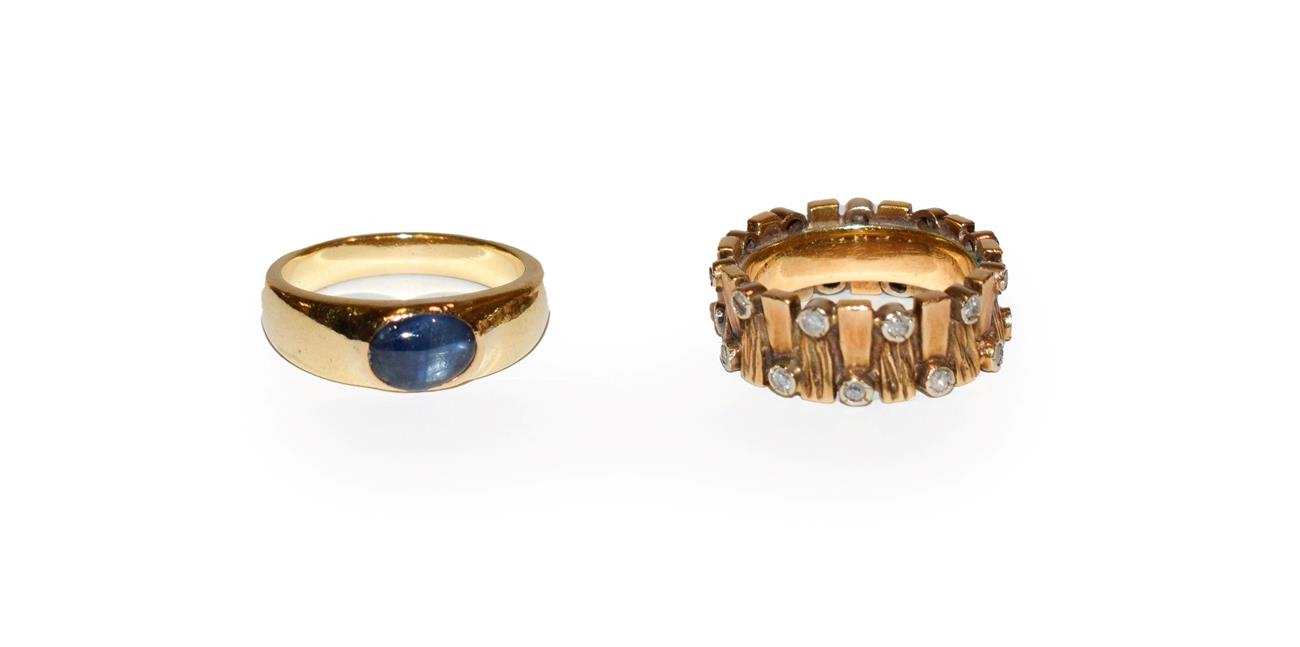 Lot 114 - A cabochon sapphire ring, stamped '18', finger size L; and a diamond set bark effect ring,...
