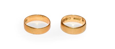 Lot 115 - A 22 carat gold band ring, finger size L; and another 22 carat gold band ring, out of shape