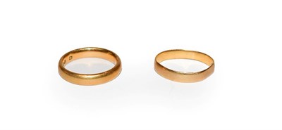 Lot 116 - A 22 carat gold band ring, finger size J; and another 22 carat gold band ring, out of shape