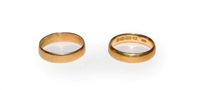 Lot 118 - A 22 carat gold band ring, finger size M; and another 22 carat gold band ring, out of shape