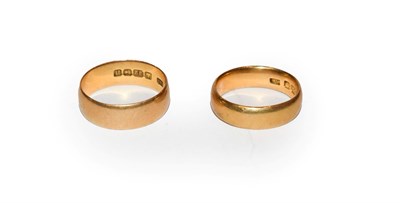 Lot 119 - A 22 carat gold band ring, finger size O1/2; and another 22 carat gold band ring, out of shape