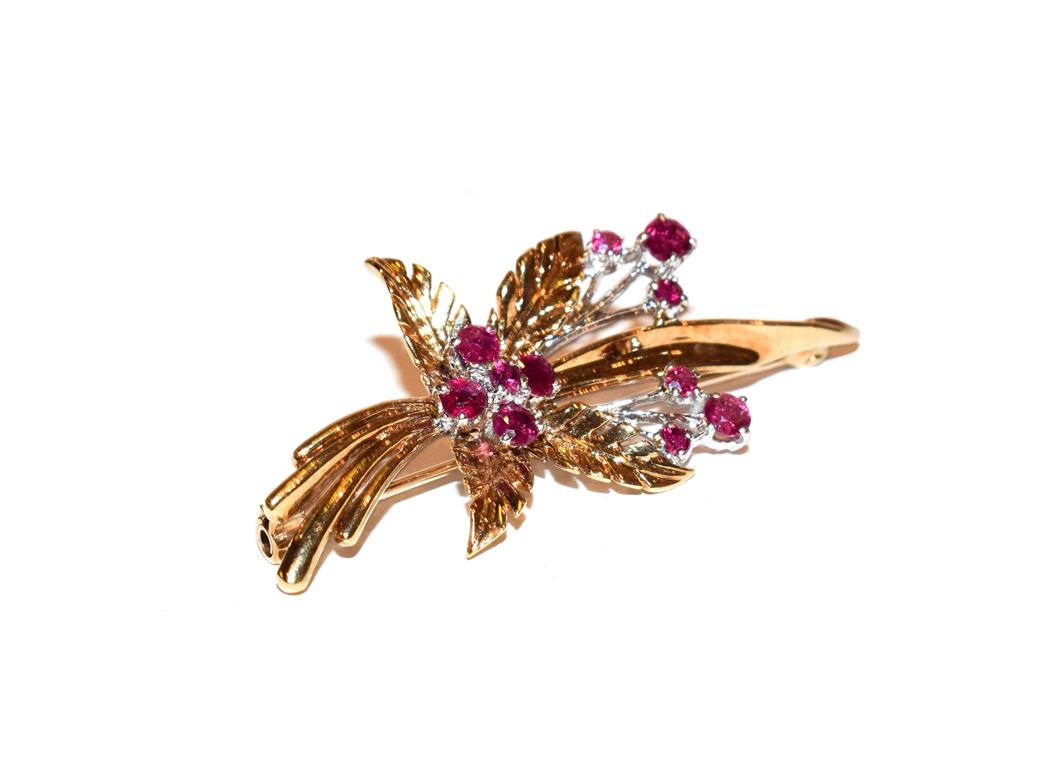Lot 121 - A 9 carat gold ruby brooch, realistically modelled as a floral spray, the yellow textured...
