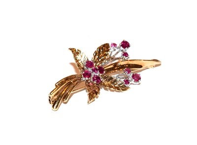 Lot 121 - A 9 carat gold ruby brooch, realistically modelled as a floral spray, the yellow textured...