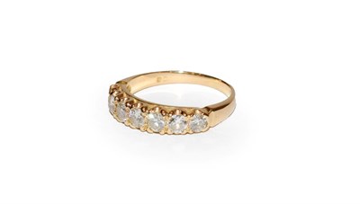 Lot 122 - A diamond seven stone ring, the graduated round brilliant cut diamonds in yellow claw settings,...
