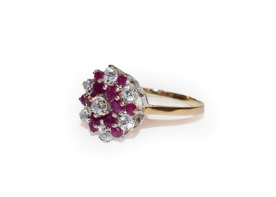 Lot 125 - A 9 carat gold synthetic ruby and white stone cluster ring, finger size Q