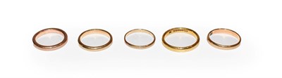 Lot 128 - Three 9 carat gold band rings, finger sizes L, M1/2 and Q1/2; and two further band rings,...