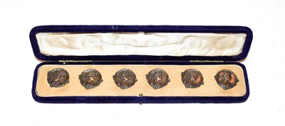 Lot 138 - A cased set of six Edward VII silver buttons, by William J. Holmes, Birmingham, 1902, each circular
