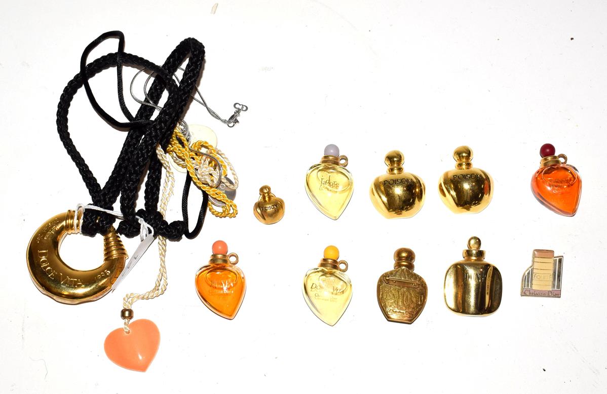 Lot 141 - Christian Dior Parfums items including four miniature glass scent bottles, two ceramic glazed heart
