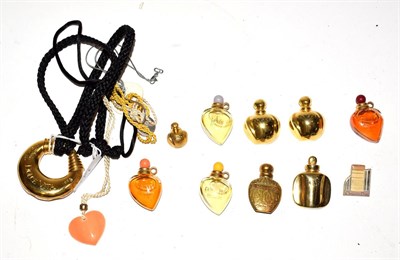 Lot 141 - Christian Dior Parfums items including four miniature glass scent bottles, two ceramic glazed heart