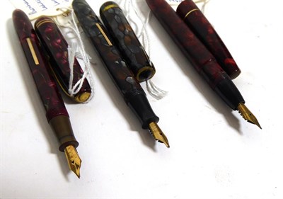 Lot 143 - A Swan Blackbird fountain pen with nib stamped 14C, a Mabie, Todd & Co. Ltd pencil, a Burnham...