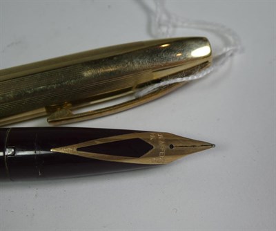 Lot 152 - A Sheaffer fountain pen with nib stamped 14K, the case stamped Made In Australia, a Sheaffer...