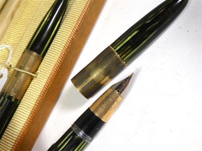 Lot 165 - A Sheaffer fountain pen with nib stamped Lifetime 14K (engraved case) and matching pencil, a...